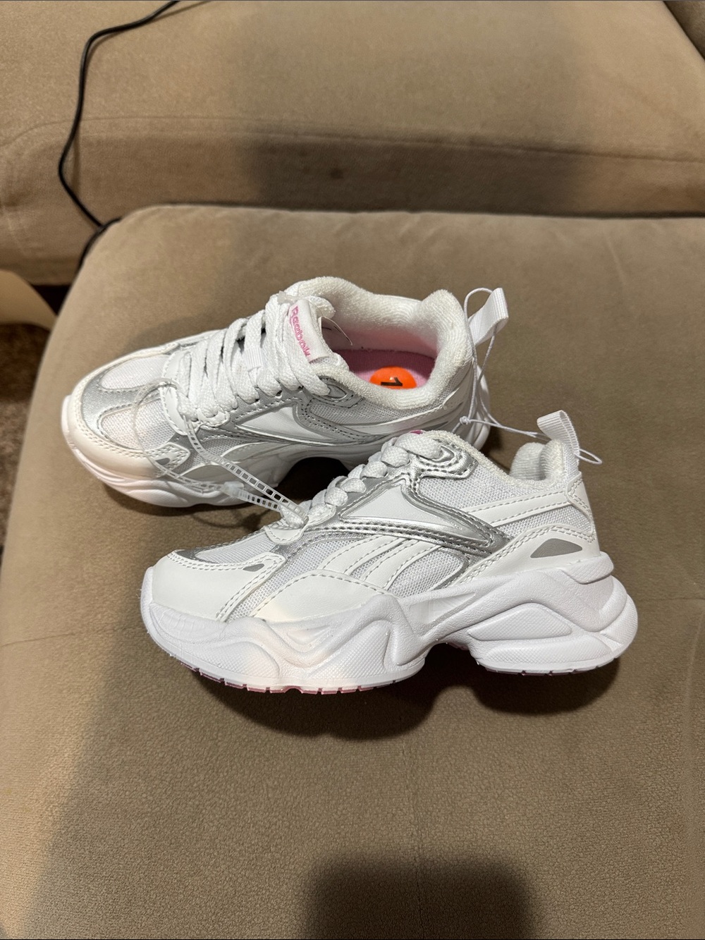 Reebok girls platform white and silver sneakers.